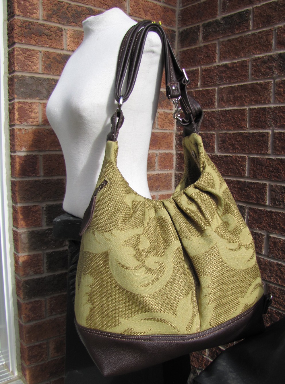 Extra large canvas bag with leather straps, base, and zipper top closure convertible backpack